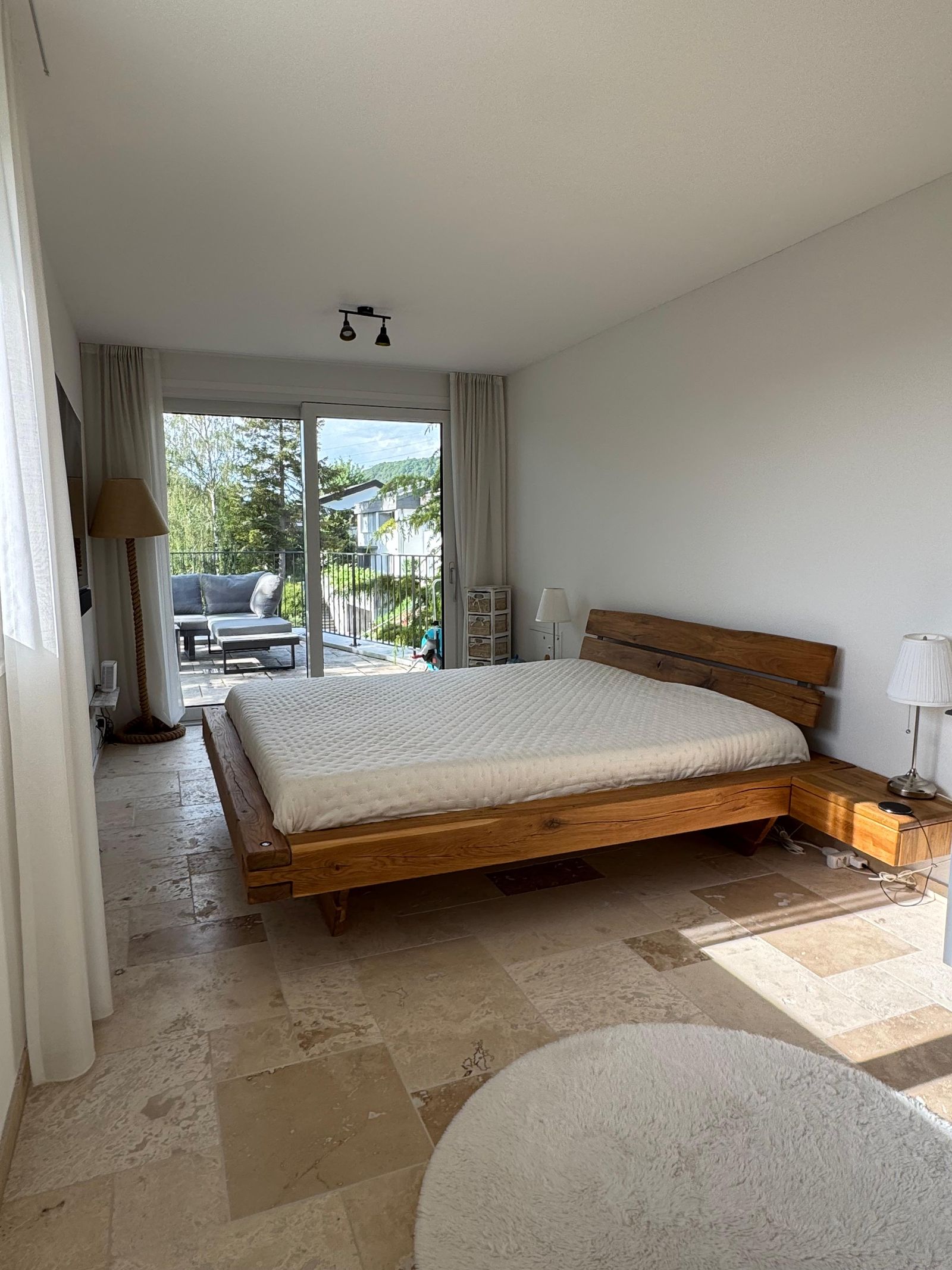 Upper-floor bedroom with a solid-wood bed, 180 by 200 cm