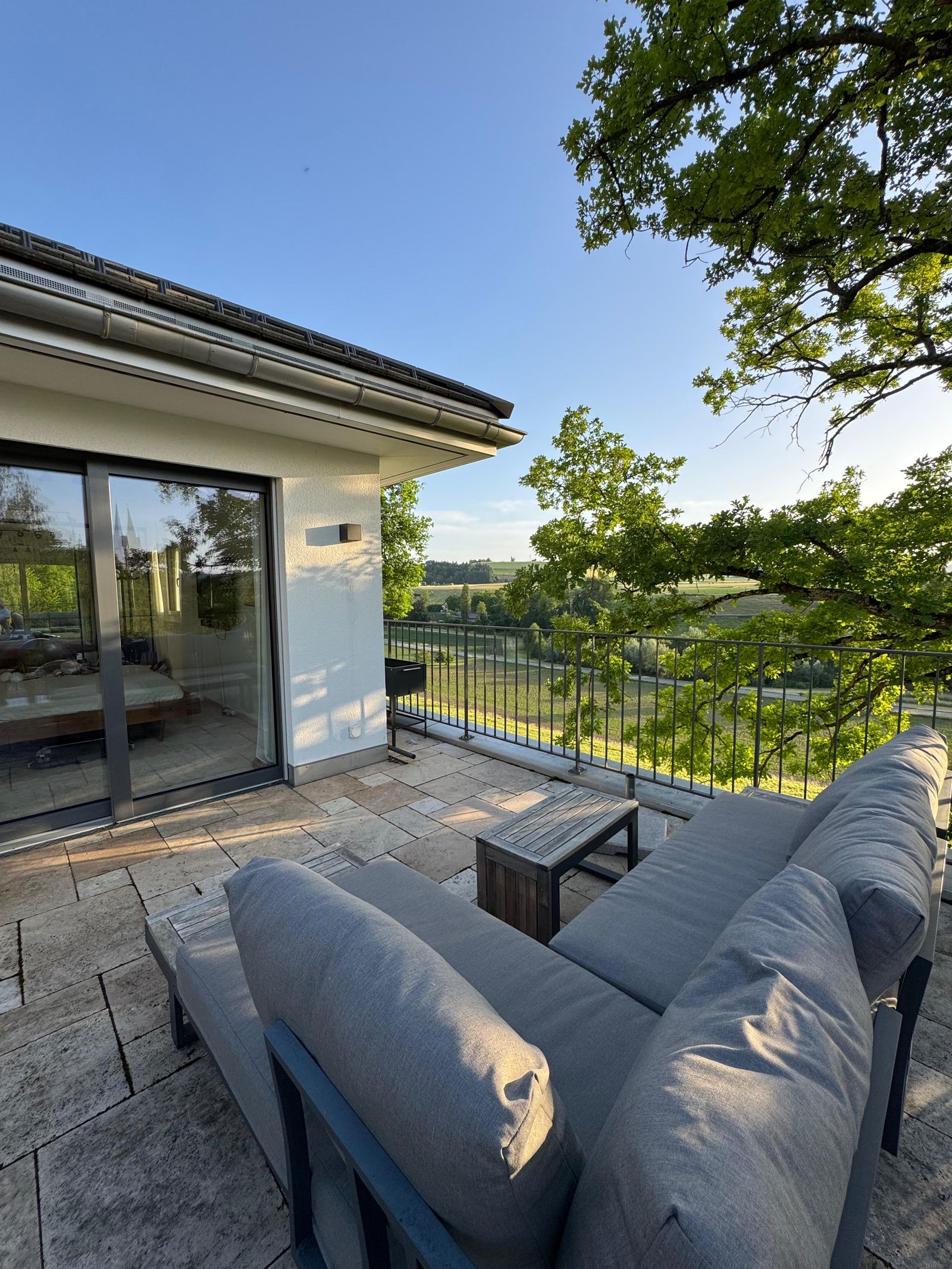 The terrace at Villa 77, looking out over forest and meadow