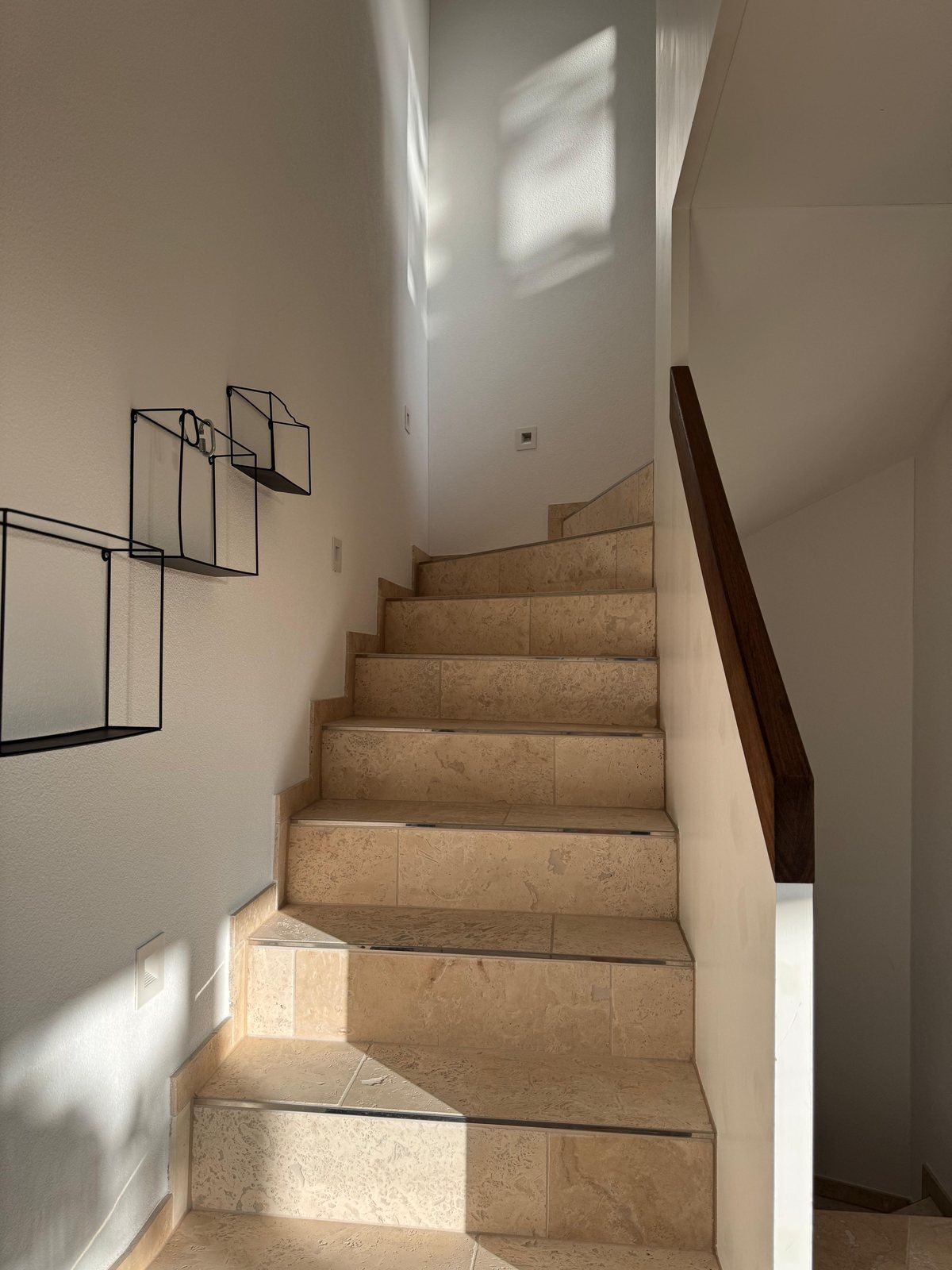 Travertine natural-stone staircase in furnished private house, Switzerland